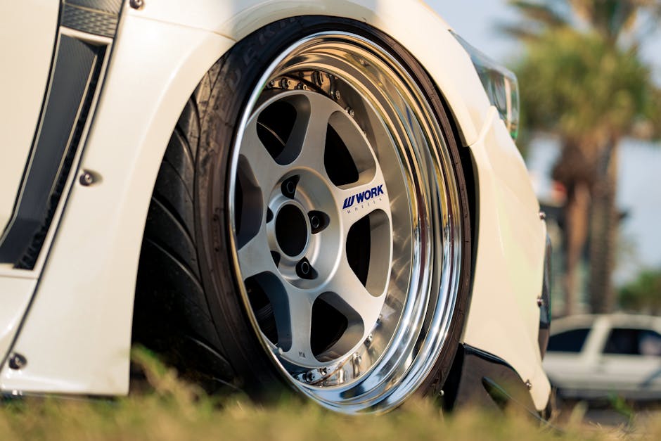 Technician precisely installing a new car tire